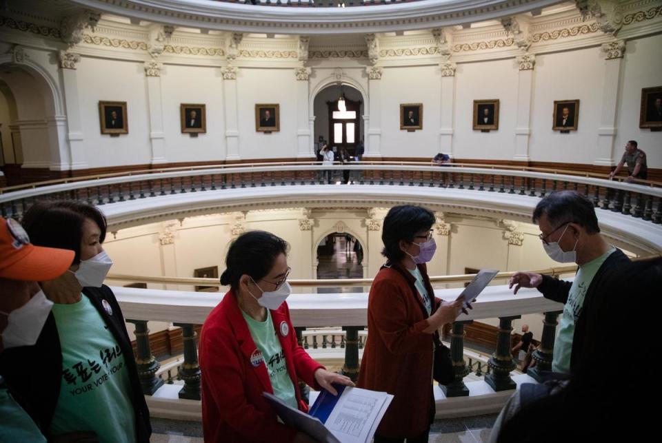 Hyunja Norman, executive director of Woori Juntos, leads her group through the state Capitol rotunda as they make their way to their next lawmaker meeting on Asian American Pacific Islander (AAPI) Advocacy Day on March 9, 2023. The group hoped to speak with lawmakers and seek support for bills that would improve language access for Korean and Spanish speakers in regards to health and social services,