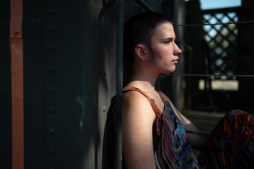 Stillwater, Minnesota: R (prefers not to give their name), 16, poses for a portrait on August 2, 2023 in Stillwater, MN. R. is a trans teenager who lives with his family in Wisconsin, where he has faced transphobia and a lack of access to healthcare. However, crossing the border into Minnesota his famiy has found more safety, community and gender-affirming care.