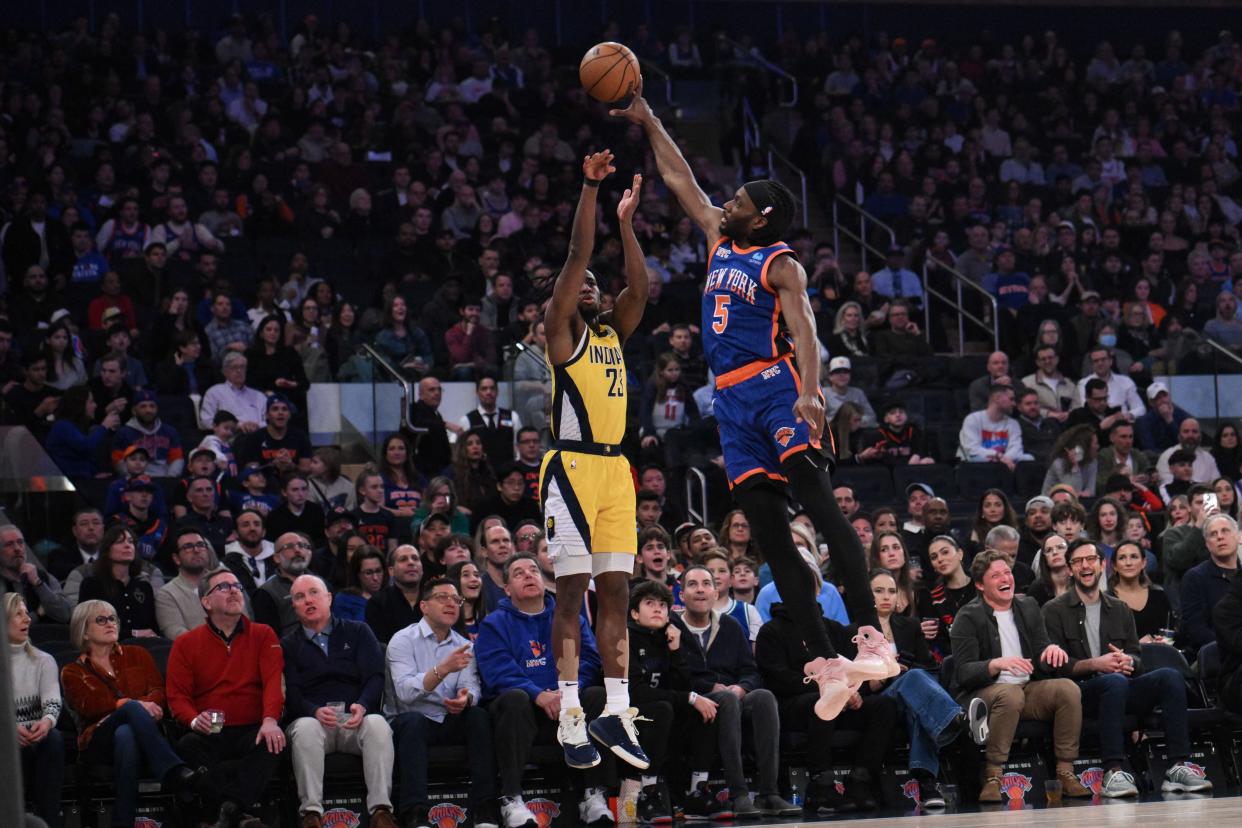 Feb 10, 2024; New York, New York, USA; New York Knicks forward Precious Achiuwa (5) blocks a shot attempt by Indiana Pacers forward Aaron Nesmith (23) during the first quarter at Madison Square Garden. Mandatory Credit: John Jones-USA TODAY Sports
