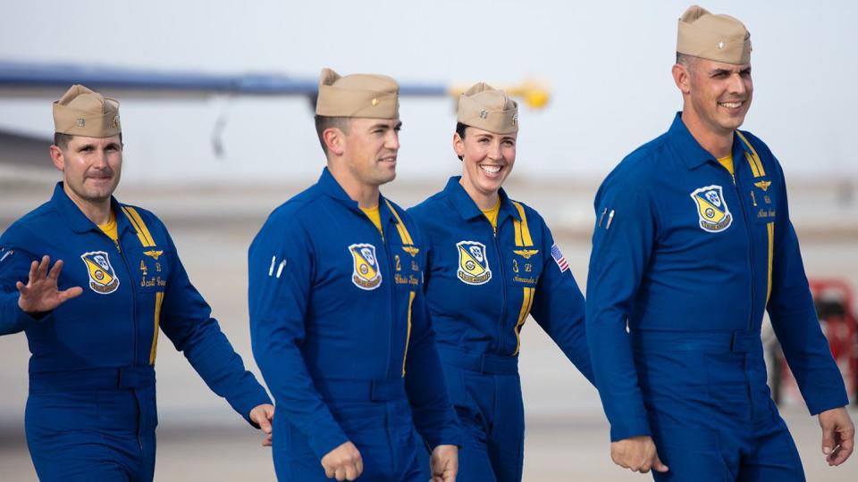 Lt. Amanda Lee and Blue Angels  teammates — from left, Lt. Scott Goossens, Lt. Cmdr. Christopher Kapuschansky and flight leader Cmdr. Alexander P. Armatas — greet spectators after completing their last practice session March 10 before The Blues’ first show of the 2023 season the following day at Naval Air Facility El Centro, Calif. (Alan de Herrera/Special to Navy Times)