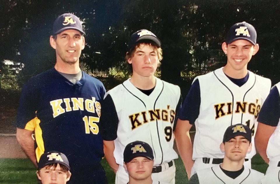 Joe Biagini (far right) stands with his father, Rob Biagini, and teammates. (Credit: Matt Berry)