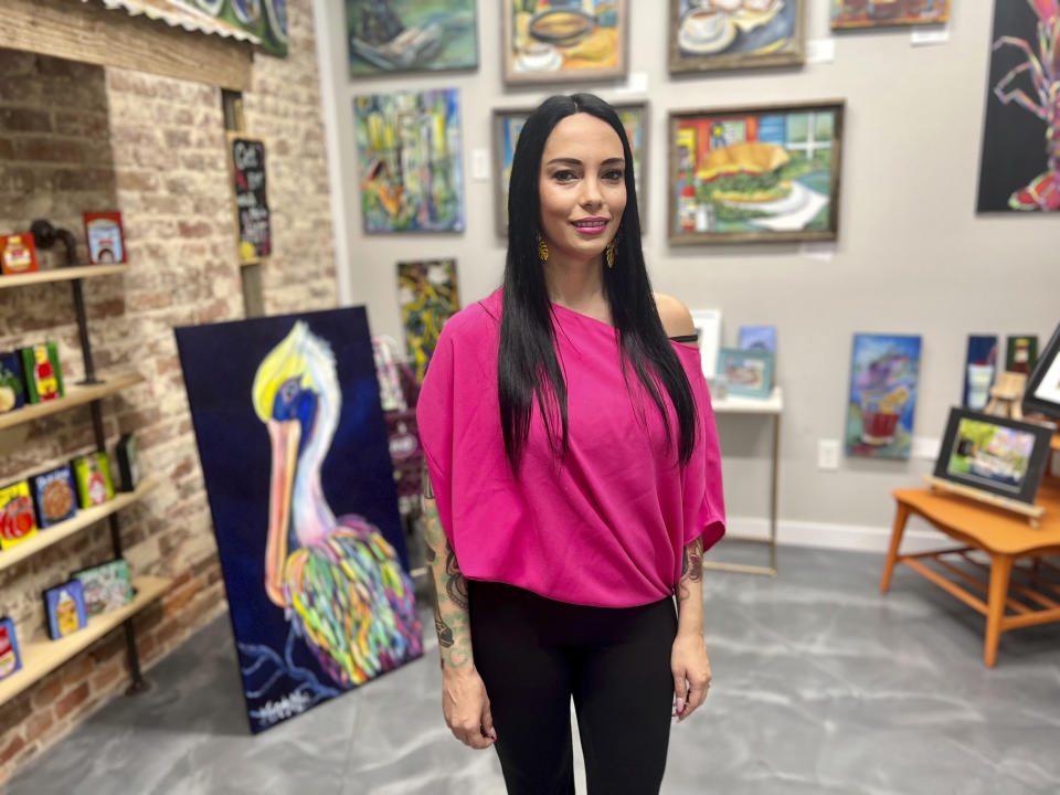 Louisiana artist Mandy Poche poses for a photo at her gallery in Ponchatoula, La., Nov. 1, 2022. (AP Photo/Stephen Smith)