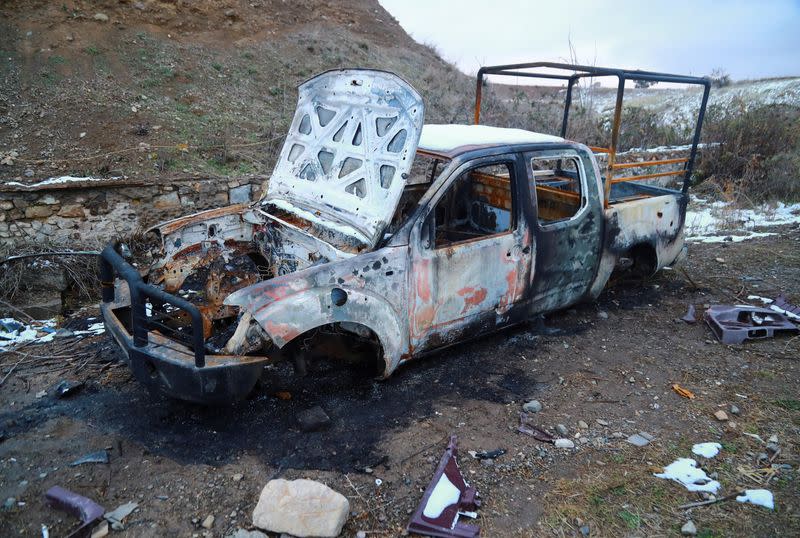 FILE PHOTO: A view shows a burnt vehicle in Jabrayil District