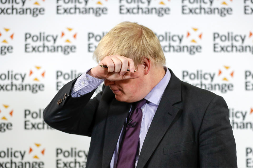 Britain's Foreign Secretary Boris Johnson wipes his forehead as he delivers a speech at the Policy Exchange in London, Wednesday Feb. 14, 2018. The Foreign Office says Johnson will use a speech Wednesday to argue for "an outward-facing, liberal and global Britain" after the U.K. leaves the bloc. (Simon Dawson/Pool via AP)