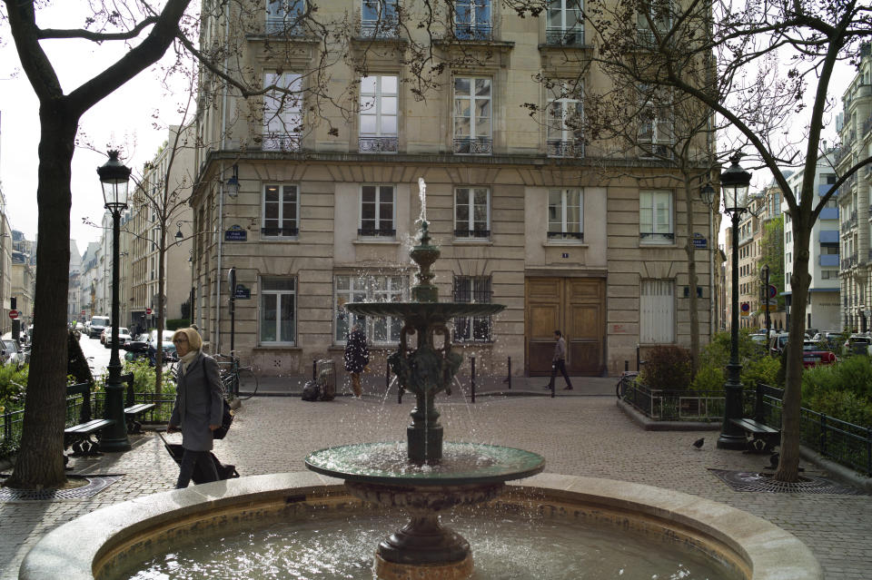 People walk in the Place de d'Estrapade, in Paris, Friday, April 21, 2023. The immense success of the Netflix series "Emily in Paris" has transformed a quiet, untouched square in the French capital into a tourist magnet. (AP Photo/Thibault Camus)