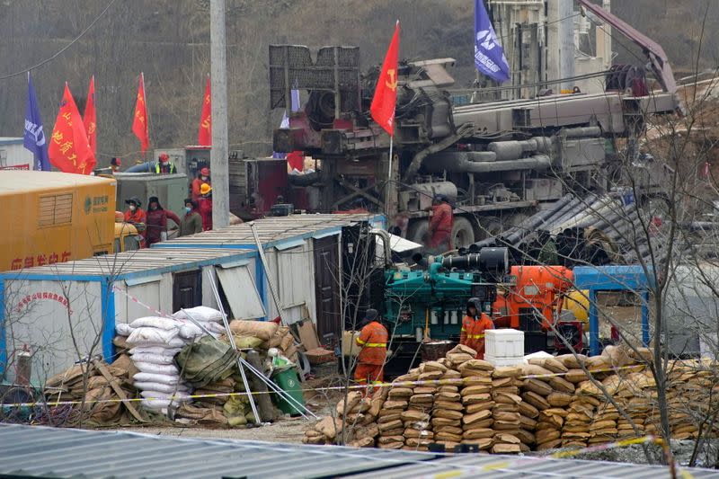 Rescuers work at the Hushan gold mine where workers were trapped underground after the Jauary 10 explosion, in Qixia