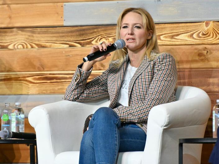 Singer-songwriter Jewel speaks on stage at a conference