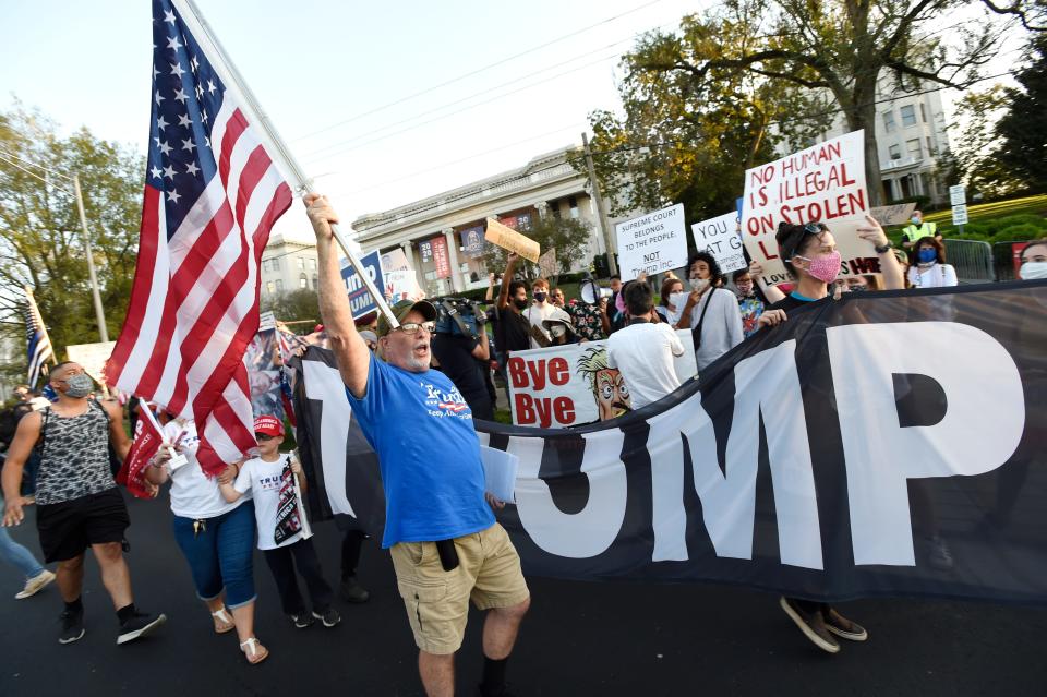 A Trump supporter shouts in front of Black Lives Matters protesters before the final presidential debate between Donald Trump and Joe Biden Thursday, Oct. 22, 2020, at Belmont University in Nashville.