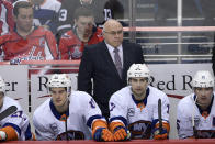 FILE - In this April 6, 2019, file photo, New York Islanders head coach Barry Trotz, top center, watches from the bench during the third period of an NHL hockey game against the Washington Capitals, in Washington. Trotz faces a familiar foe with New York preparing to open the first round against his former team, the Washington Capitals. (AP Photo/Nick Wass, File)