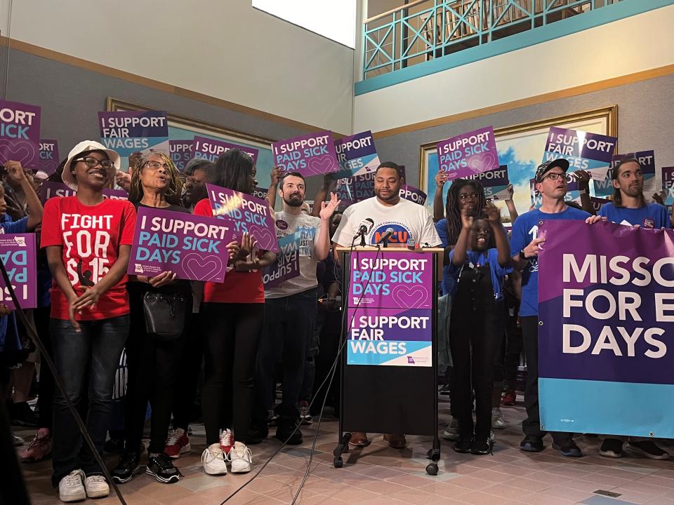 DeMarco Davidson addresses supporters from the Missourians for Health Families and Fair Wages, a group that submitted signatures in favor of a ballot initiative to raise the minimum wage and guarantee paid sick leave for Missouri workers.