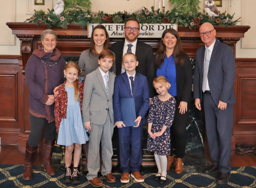 Oyster River Middle School student Noah Sanders has been sworn in as a member of 2024 New Hampshire's Kid Governor Executive Council. Front row, from left, Cambrie, Jackson, Noah, and Madelyn Sanders; back row, Fifth Grade Teacher Diana Pelletier, mother Astrid Sanders, father Steve Sanders, Sen. Rebecca Perkins Kwoka, and Superintendent James C. Morse, Sr.