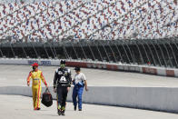 Drivers walk to their cars for the start of the NASCAR Cup Series auto race Sunday, May 17, 2020, in Darlington, S.C. (AP Photo/Brynn Anderson)