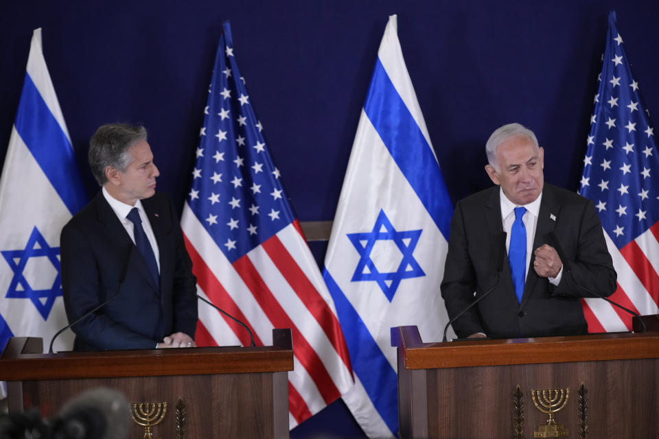 U.S. Secretary of State Antony Blinken, left, and Israel's Prime Minister Benjamin Netanyahu make statements to the media inside The Kirya, which houses the Israeli Ministry of Defense, after their meeting in Tel Aviv, Thursday Oct. 12, 2023. President Joe Biden is dispatching his top diplomat to Israel on an urgent mission to show U.S. support after the unprecedented attack by Hamas militants. (AP Photo/Jacquelyn Martin, pool)