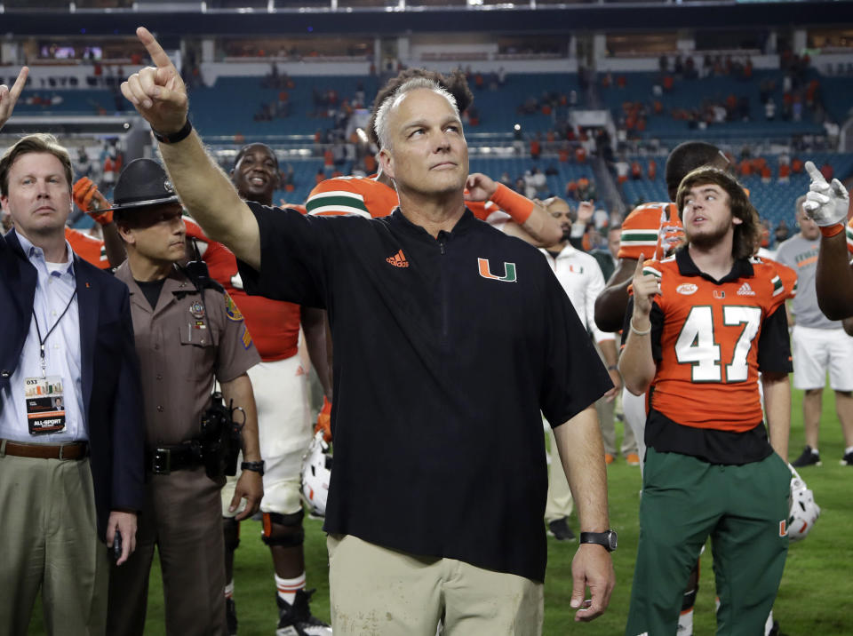 Miami head coach Mark Richt stands for the national anthem after an NCAA college football game against Pittsburgh, Saturday, Nov. 24, 2018, in Miami Gardens, Fla. Miami won 24-3. (AP Photo/Lynne Sladky)