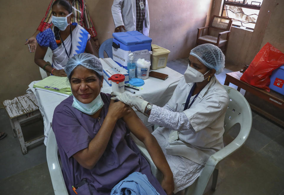 A medical staff receives her second dose of COVID-19 vaccine at a government Hospital in Hyderabad, India, Monday, Feb. 15, 2021. (AP Photo/Mahesh Kumar A.)