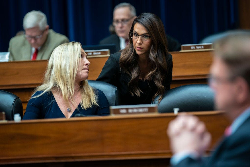 Marjorie Taylor Greene and Lauren Boebert at a meeting on Capitol Hill