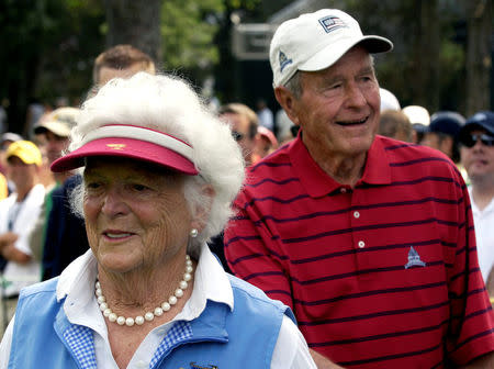 FILE PHOTO - Former U.S. President George H.W. Bush (R) and his wife Barbara watch the Earl Woods Memorial Pro-Am before the start of the AT&T National PGA golf tournament at Congressional Country Club in Bethesda, Maryland, July 4, 2007. REUTERS/Jonathan Ernst/File Photo