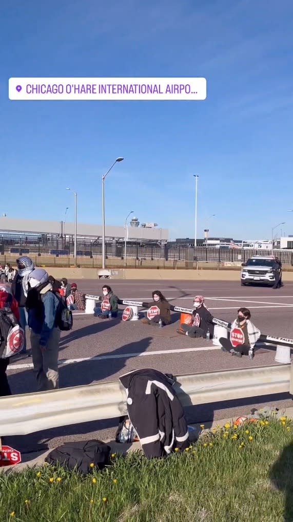 Protestors blocking traffic at O’Hare. Chicago Dissenters