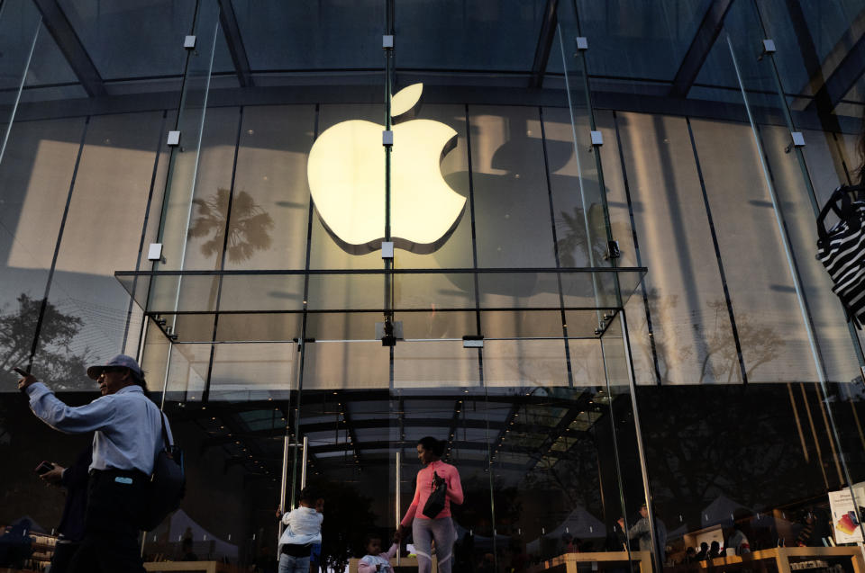 FILE - In this June 15, 2019, file photo customers leave an Apple store on the 3rd Street Promenade in Santa Monica, Calif. Big Tech companies reported mixed quarterly earnings on Thursday, July 30, 2020, a day after their top executives faced a tough congressional grilling over their market power and alleged monopolistic practices. (AP Photo/Richard Vogel, File)