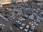 People gather to buy cars before the expected increase of VAT to 15% in Riyadh