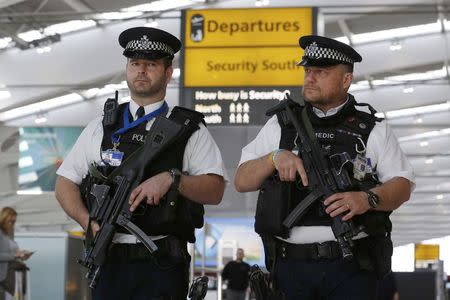 Armed police patrol at Terminal 5, Heathrow Airport in London, Britain, in this file photograph dated March 22, 2016. REUTERS/Luke MacGregor/Files