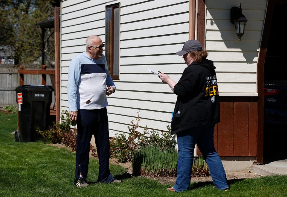 John Vander Lugt, 72, of Grand Rapids, talks with Rae Westerhof who had been walking around his neighborhood canvassing for State Rep. John Fitzgerald of House District 83 on Friday, April 19, 2024.