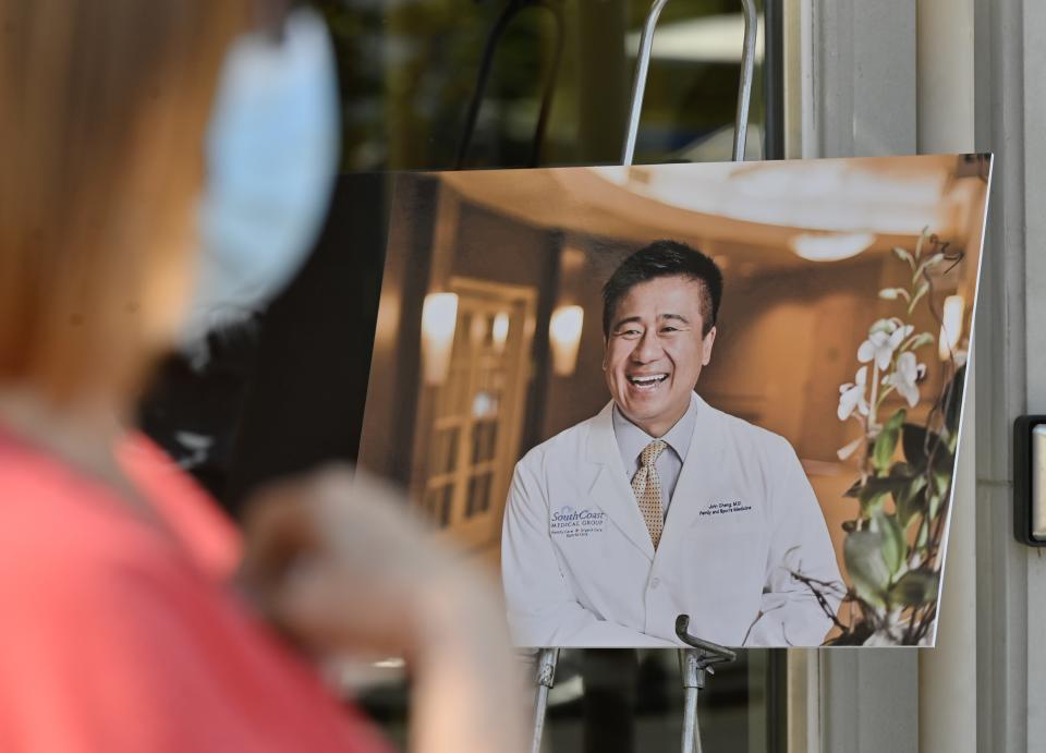 Aliso Viejo, CA - May 16: Deborah Kipers, a patient of shooting victim Dr. John Cheng, talks about him outside his office in Aliso Viejo, CA, on Monday, May 16, 2022. Cheng was killed in a shooting at Geneva Presbyterian Church in Laguna Woods on May 15. 
(Photo by Jeff Gritchen/MediaNews Group/Orange County Register via Getty Images)