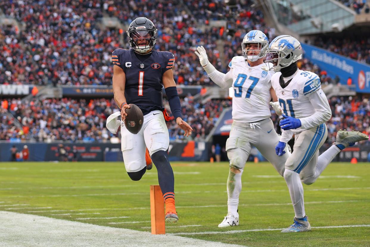Justin Fields of the Chicago Bears runs the ball for a touchdown during the fourth quarter in the game against the Detroit Lions at Soldier Field on Dec. 10, 2023, in Chicago, Illinois.