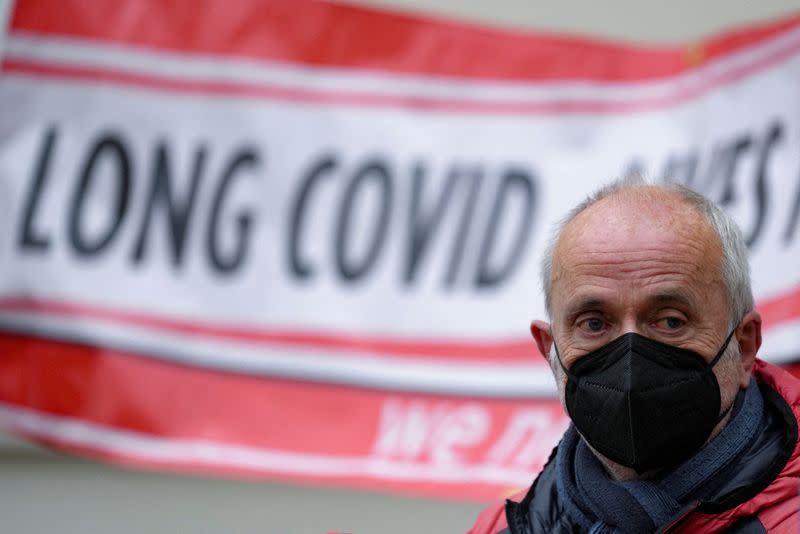 FILE PHOTO: Family members of people who died during the COVID-19 pandemic hold banners outside the UK COVID-19 Inquiry in London