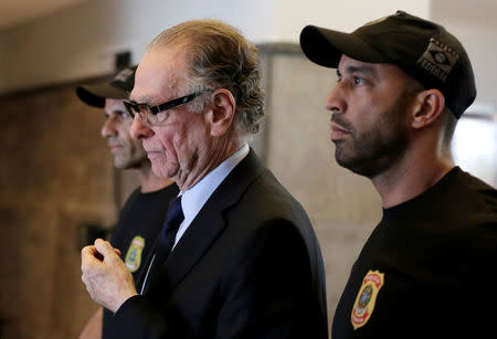 Brazilian Olympic Committee (COB) President Carlos Arthur Nuzman leaves the Federal Police headquarters heading to jail, in Rio de Janeiro, Brazil, October 5, 2017. REUTERS/Bruno Kelly