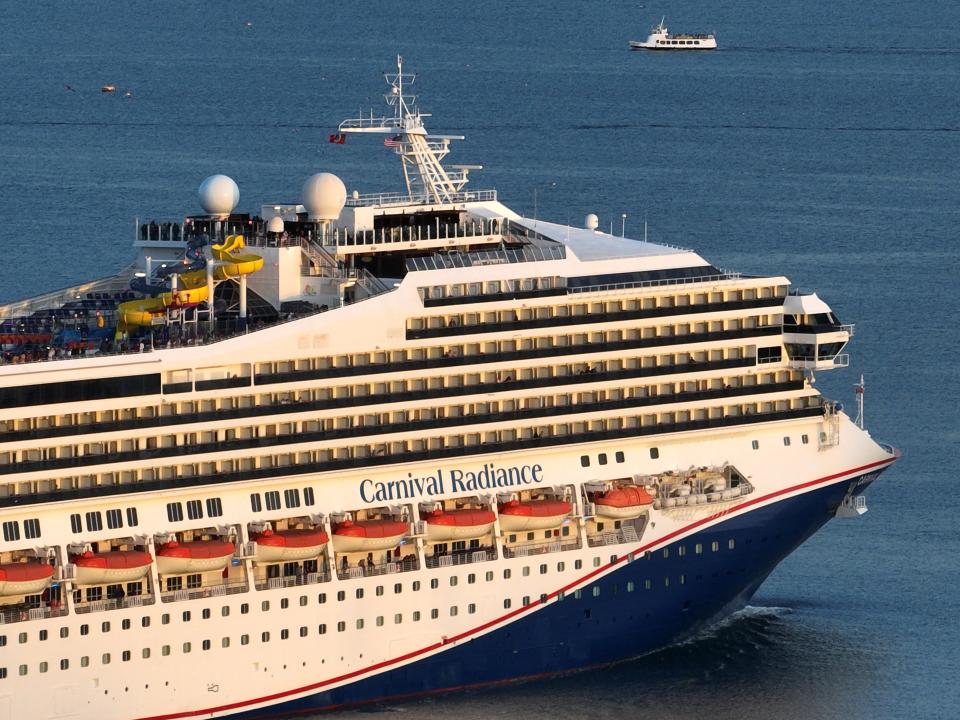 LONG BEACH, CA - FEBRUARY 17: An aerial view of the Carnival Radiance, a Destiny-class cruise ship, as it heads out to sea in Long Beach at sunset on Friday, February 17, 2023. (Allen J. Schaben /Los Angeles Times via Getty Images)