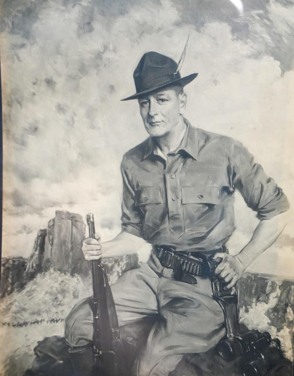 Roy Chapman Andrews is pictured with his guns, binoculars and hat in a photo seen among many other artifacts, photographs and books at The Logan Museum in Beloit. Some believe that Andrews, a Beloit College alumnus, was the inspiration for Indian Jones.