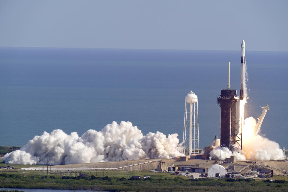 A SpaceX Falcon 9 rocket on a resupply mission to the International Space Station lifts off from pad 39A at the Kennedy Space Center in Cape Canaveral, Fla., Sunday, Dec. 6, 2020. (AP Photo/John Raoux)