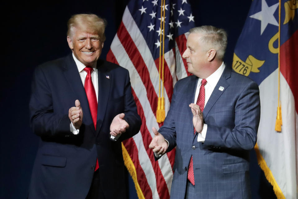 FILE - Former President Donald Trump, left, is welcomed by Michael Whatley, Chairman of the N.C. GOP, before he speaks at the North Carolina Republican Convention, June 5, 2021, in Greenville, N.C. Donald Trump is calling for a shakeup at the highest levels of the Republican National Committee. And party leaders are taking it very seriously. (AP Photo/Chris Seward, File)