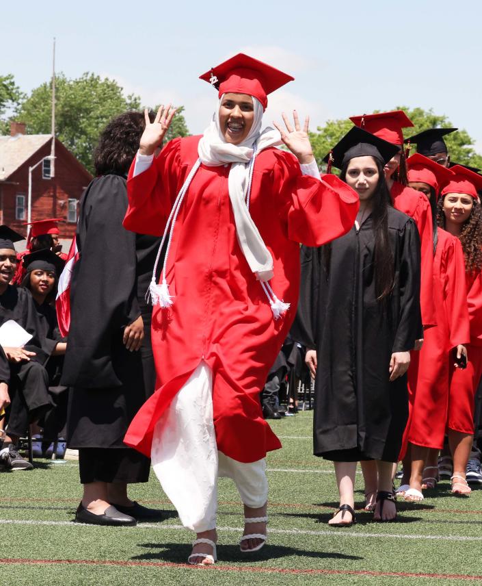 Brockton High School's Isabella Abraham receives her diploma during the 156th graduation exercises on Saturday, June 4, 2022.