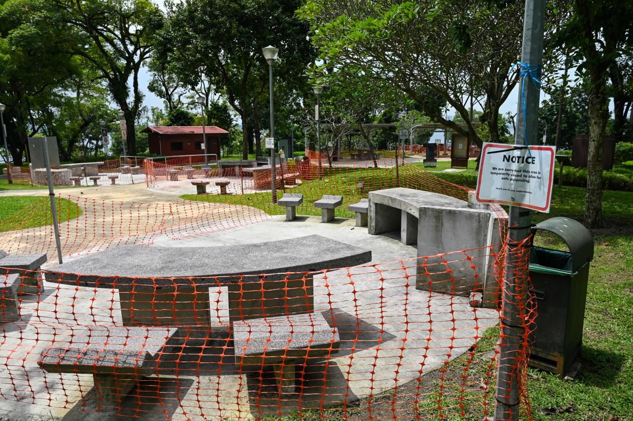 Barbeque pits are cordoned off at a park in Singapore on May 20, 2021, as the country tightened restrictions after several new clusters of Covid-19 coronavirus cases were found. (Photo by Roslan RAHMAN / AFP) (Photo by ROSLAN RAHMAN/AFP via Getty Images)