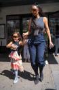 <p>West was already making fashion statements at five years old. For a day out in the city, she wore a black tank top and printed tiered skirt, finished with large black sunglasses.</p>