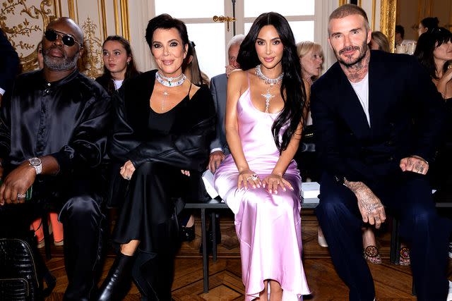 <p>Francois Goize/WWD via Getty Images</p> (Left to right) Corey Gamble, Kris Jenner, Kim Kardashian and David Beckham attend the Victoria Beckham show