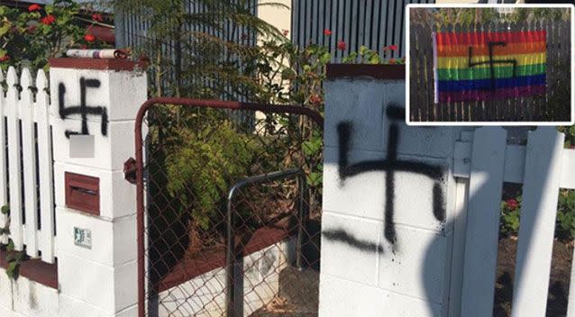 A Queensland woman woke up to find her rainbow flags spray painted with swastikas.