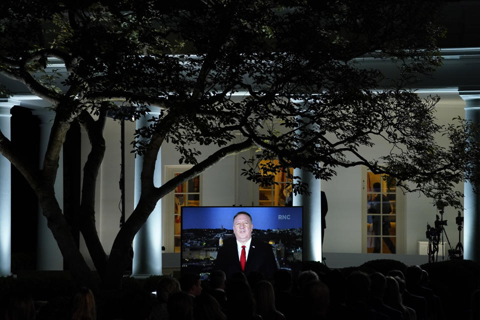 A video of Secretary of State Mike Pompeo speaking during the Republican National Convention plays from the Rose Garden of the White House, Tuesday, Aug. 25, 2020, in Washington. (AP Photo/Evan Vucci)