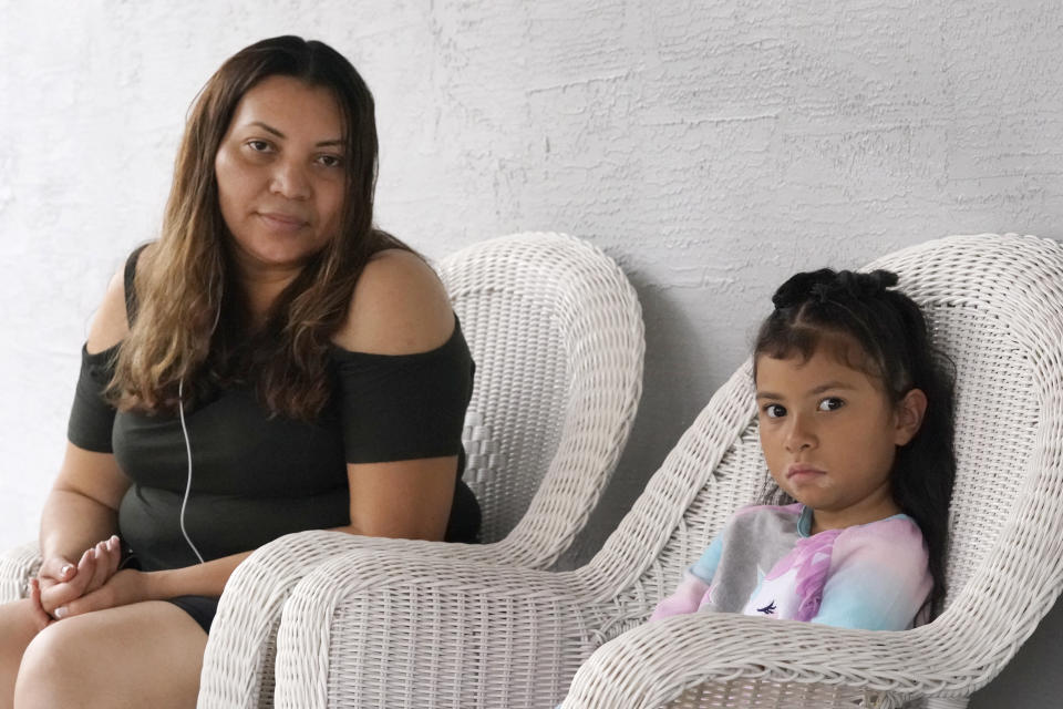 Temporary Protected Status (TPS) holder Lili Montalvan, left, of El Salvador, poses for a photo with her daughter Roxana Gozzer, 6, Sunday, Oct. 25, 2020, at their home in Fort Lauderdale, Fla. (AP Photo/Wilfredo Lee)