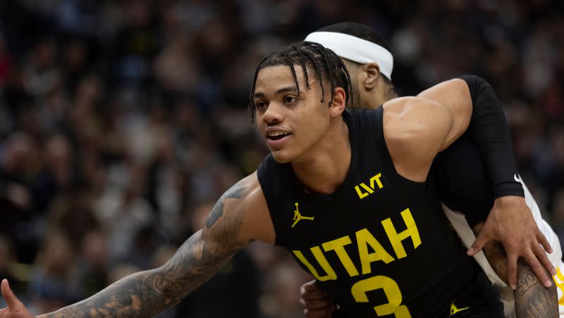 Utah Jazz guard Keyonte George (3) posts up against Golden State Warriors guard Gary Payton II (0) during a game at the Delta Center in Salt Lake City on Monday, Feb. 12, 2024.