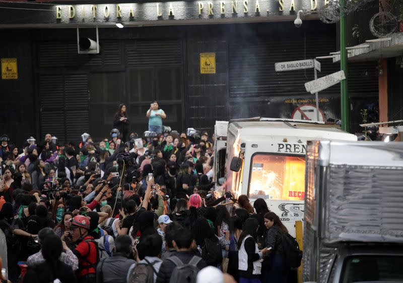 People take part in a protest against gender-based violence in downtown of Mexico City