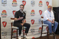 Jimmie Johnson, left, speaks about joining the team of Chip Ganassi, right, for the IndyCar series at a press conference during the IndyCar race weekend Saturday, Oct. 24, 2020, in St. Petersburg, Fla. (AP Photo/Mike Carlson)