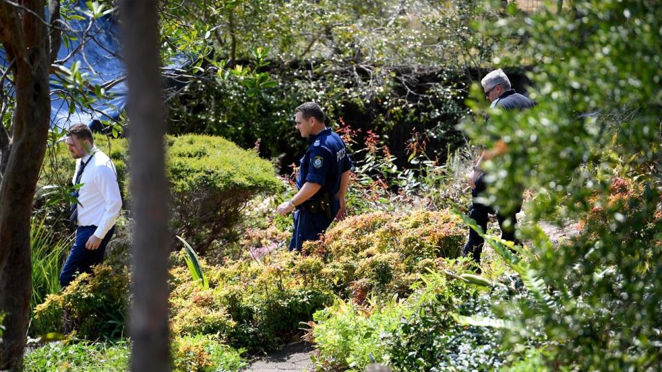 NSW Police and Forensic Services personnel are seen moving through Ms Dawson’s home in September this year. Image: AAP