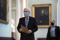 Senate Minority Leader Mitch McConnell, R-Ky., arrives at the Capitol in Washington, Friday, March 5, 2021, as the Senate steers toward a voting marathon on the $1.9 trillion COVID-19 relief bill that's expected to end with the chamber's approval of the measure. (AP Photo/J. Scott Applewhite)