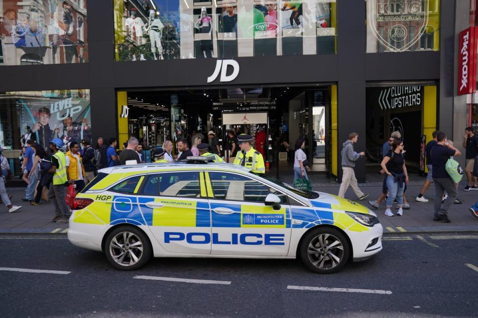 Police on Oxford Street were seen tackling youths to the ground (PA Wire)