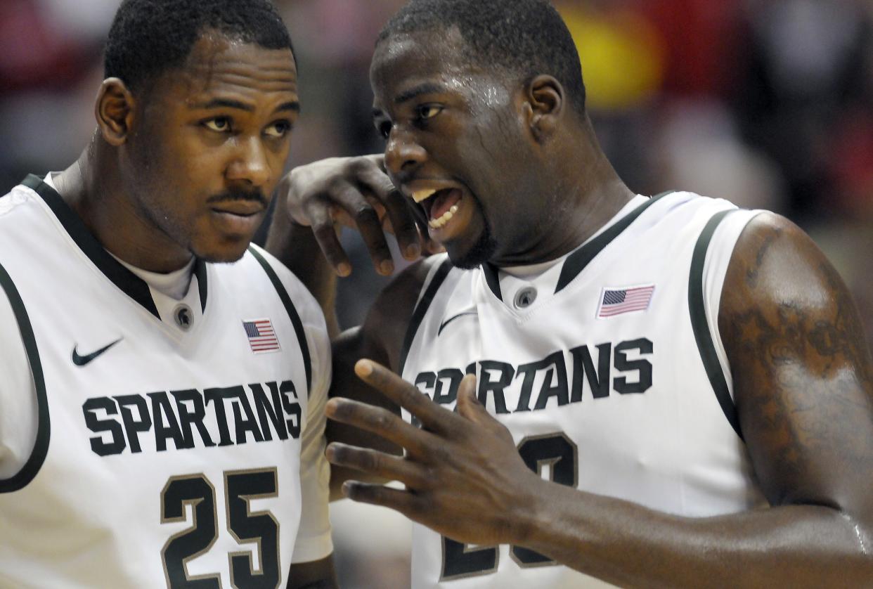 MSU's Draymond Green, right, talks with teammate Derrick Nix   in the second half against  Iowa in the Big Ten Tournament, March 9, 2012.