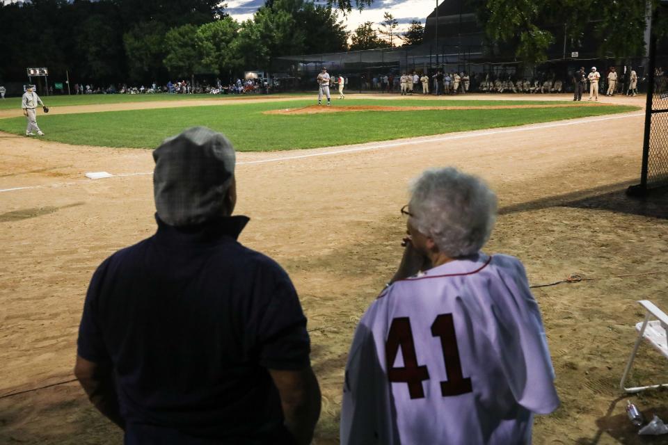 Dotty Corsi (right), mother of the late Red Sox pitcher Jim Corsi, watches her grandson, Joe, play in the 28th annual Abbot Financial Management Oldtime Baseball Game in Cambridge, Aug. 24, 2022.