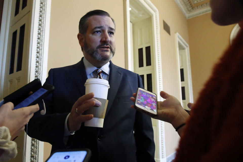 Sen. Ted Cruz, R-Texas, talks to reporters outside the Senate chamber prior to the start of the impeachment trial of President Donald Trump at the U.S. Capitol Friday Jan 31, 2020, in Washington, as Senators continue the impeachment trial for President Donald Trump. (AP Photo/Steve Helber)